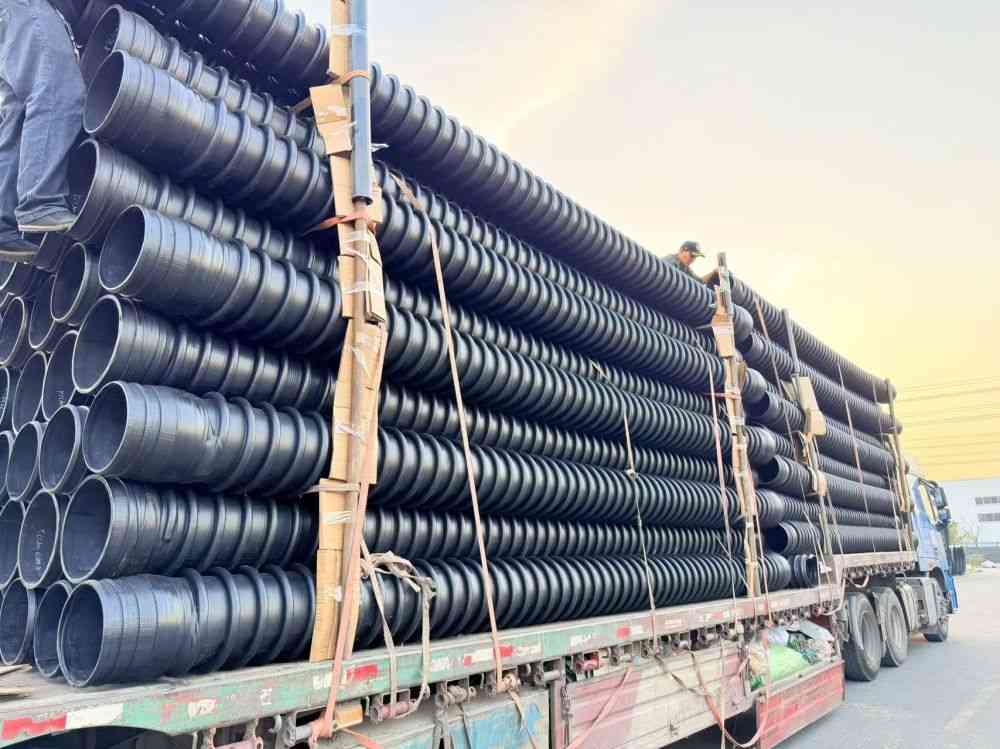 Full truck loaded with Type‑B HDPE structured‑wall pipes for Mongolia mining project land transport